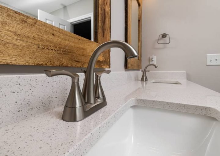 Modern bathroom with dual faucets and mirrors
