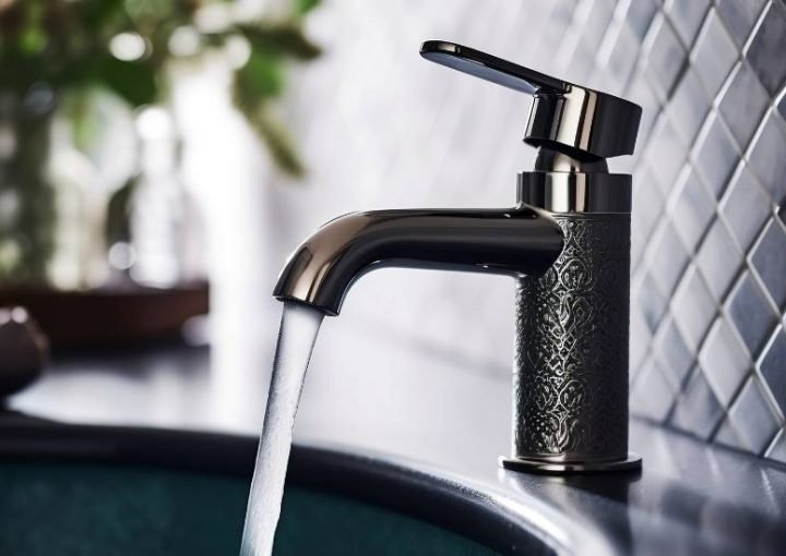 Decorative faucet with water flowing in kitchen