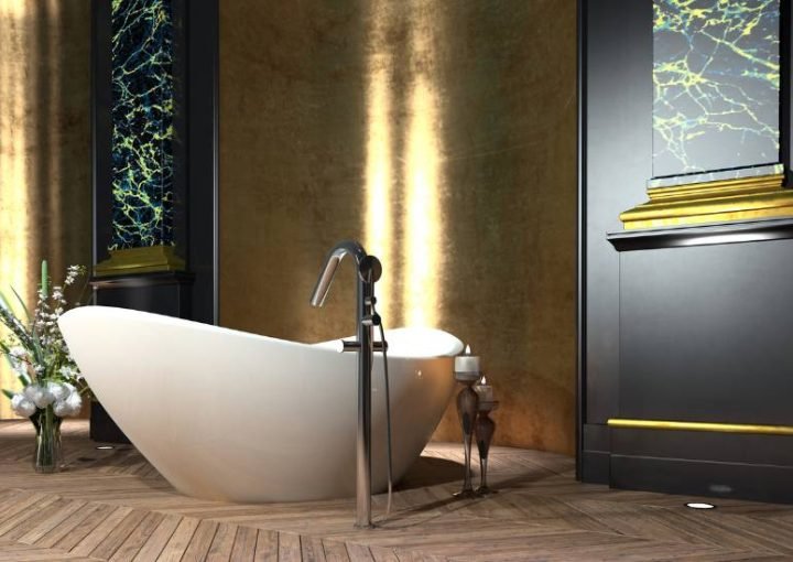 Elegant bathroom with freestanding bathtub and gold accents.