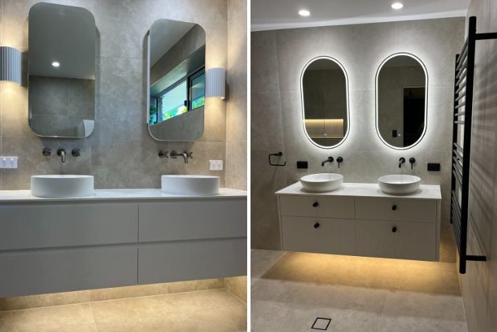 Modern bathroom with double sinks and illuminated mirrors.