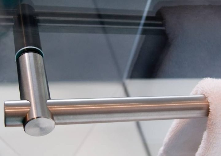 Glass door handle with stainless steel finish.
