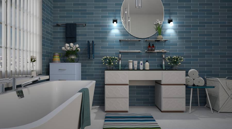Modern bathroom with blue tiles and white fixtures.