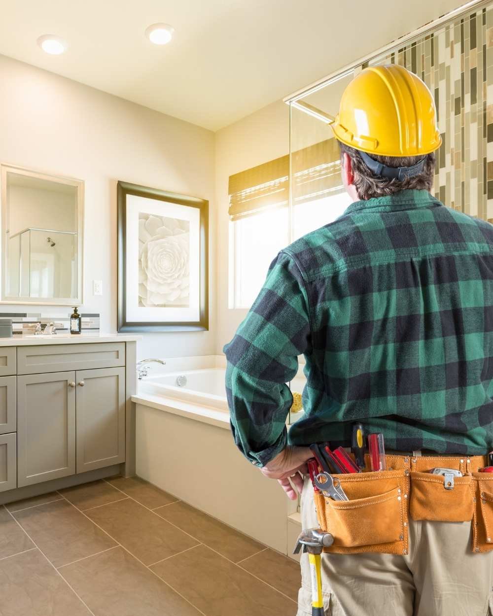 Contractor inspecting modern bathroom renovation project