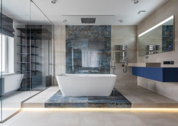 Modern bathroom with standalone bathtub and glass shower.
