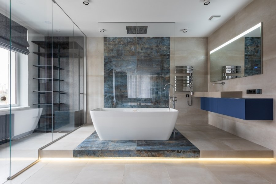 Modern bathroom with standalone bathtub and glass shower.